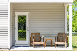 504 Sandy Hollow Drive, Jacksonville, NC 28540 – photo 1: Covered back porch
