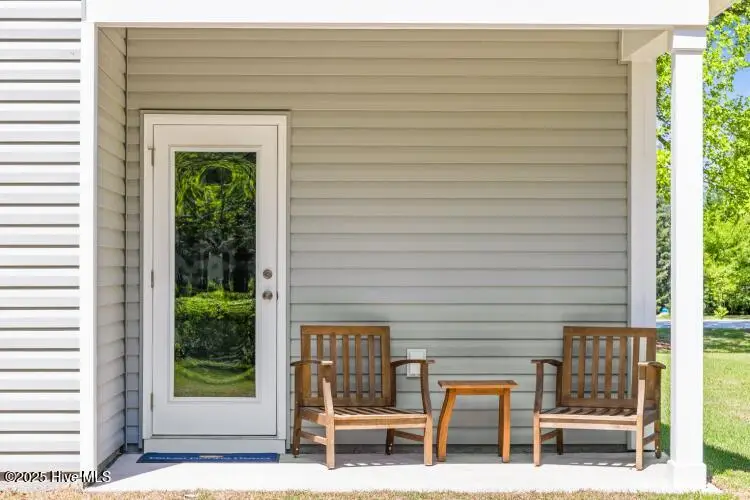 504 Sandy Hollow Drive, Jacksonville, NC 28540 – photo 1 of 22: Covered back porch