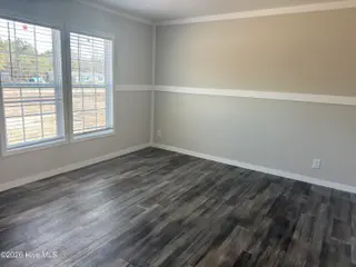 6850 Lewis Drive SE, Winnabow, NC 28479 – photo 7: Front bedroom, second bedroom