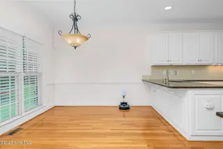 1119 Falling River Walk, Rocky Mount, NC 27804 — 4-bedroom home in River Falls, Rocky Mount, NC, photo 18 of 51: Bright Breakfast Nook, Backyard View