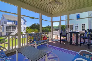 221 Sound Side Drive, Atlantic Beach, NC 28512 — 5-bedroom home in Bay Ridge, Atlantic Beach, NC, photo 7 of 60: Screened-in porch