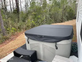 1439 New Sun Drive SE, Bolivia, NC 28422 — 4-bedroom home in Olde Georgetowne, Bolivia, NC, photo 4 of 15: 1439 Hot tub 2