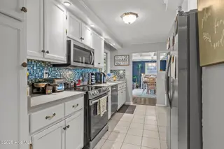 124 Oakleaf Drive, Pine Knoll Shores, NC 28512 – photo 14: 26-web-or-mls-1S3A3500