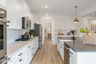 3355 Grand Park Way, Leland, NC 28451 – photo 11: Kitchen to Dining Room - Yates II B - Fo