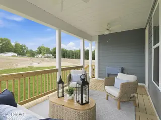 9251 Salty Breeze Place, Leland, NC 28451 — 5-bedroom home in Grand Park, Leland, NC, photo 17 of 42: Back Porch - Goodwin B - Parke at Cold C