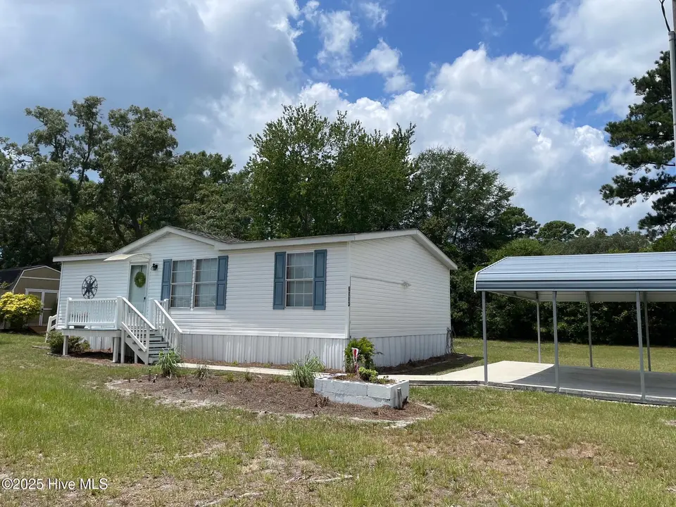 6883 Eastbrook Avenue SW, Ocean Isle Beach, NC 28469 — 2-bedroom manufactured home in Pine Acres, Ocean Isle Beach, NC, photo 1 of 25: Front