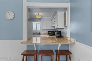 1000 Caswell Beach Road Apt. 806, Oak Island, NC 28465 — 2-bedroom condo in Oak Island Bch Villa, Oak Island, NC, photo 16 of 56: Counter Seating in Dining Area
