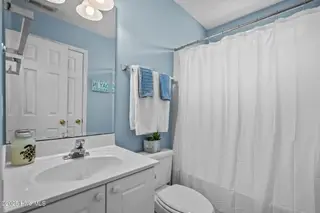 213 NE 48th Street, Oak Island, NC 28465 – photo 22: 37-web-or-mls-Photo Aug 21 2025, 11 05 5