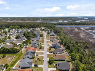 5014 N Hampton Drive SE, Southport, NC 28461 – photo 7: 7-web-or-mls-DJI_20260415124151_0399_D