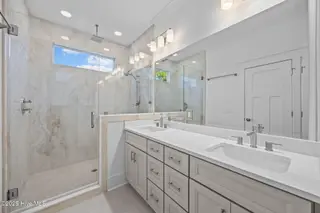 498 Genoes Point Road SW, Supply, NC 28462 – photo 23: Tiled luxury Primary Suite