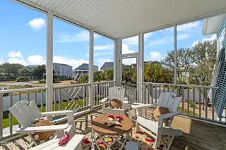 3604 W Pelican Drive, Oak Island, NC 28465 – photo 17: Screened Porch Off Living Room