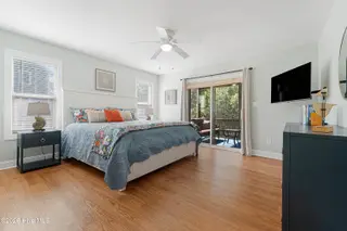 106 Wyndward Court, Emerald Isle, NC 28594 – photo 23: Primary suite with screened porch