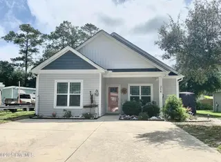 218 NE 67th Street, Oak Island, NC 28465 – photo 1: X FRONT PIC 218
