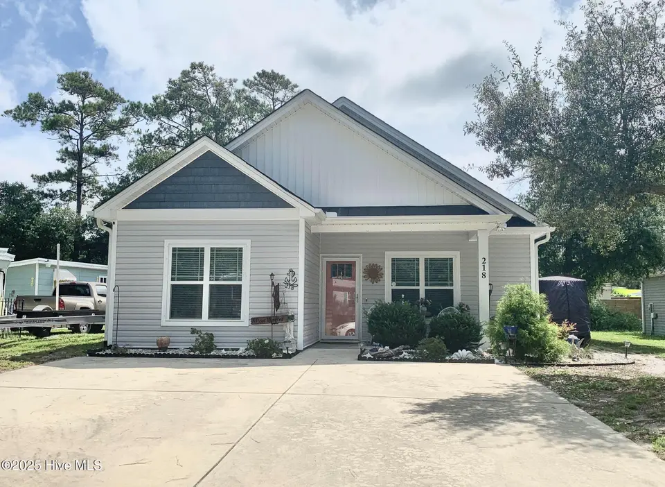 218 NE 67th Street, Oak Island, NC 28465 – photo 1 of 46: X FRONT PIC 218