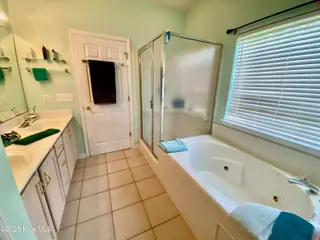 7599 Dunbar Drive SW, Sunset Beach, NC 28468 – photo 23: Primary Bath