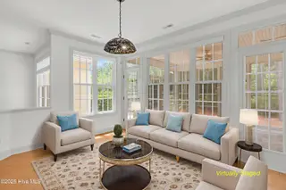 2904 Legends Drive, Southport, NC 28461 — 3-bedroom home in St James, Southport, NC, photo 19 of 71: 2904-legends-dr-living room - w disclaim