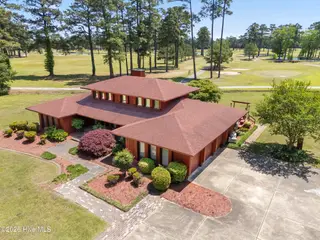 201 Country Club Drive, Elizabeth City, NC 27909 — 3-bedroom home in Country Club Forest, Elizabeth City, NC, photo 2 of 58: 051 ccd 260504 ext front drone r