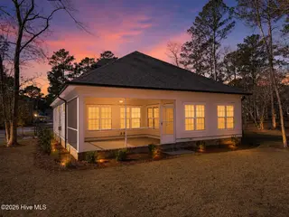 992 Ashburton Road SE, Bolivia, NC 28422 – photo 5: Rear view at sunset
