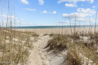 233 Sea Dreams Drive, Atlantic Beach, NC 28512 – photo 17: dunes on walkway to beach from pool