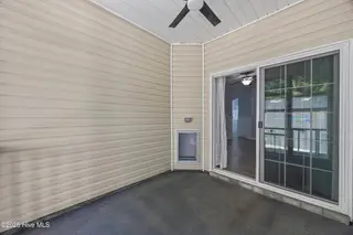 323 Cedar Island Trail, Holly Ridge, NC 28445 — 3-bedroom townhome in The Landing At Folkstone, Holly Ridge, NC, photo 16 of 36: 20_screened porch