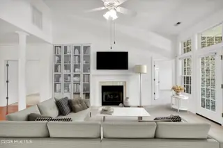 1009 N Sanderling Drive, Leland, NC 28451 — 3-bedroom townhome in Waterford of the Carolinas, Leland, NC, photo 7 of 63: Staged Living Room
