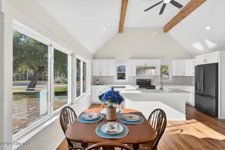 501 Shoreline Drive E, Sunset Beach, NC 28468 – photo 6: Bright kitchen with wall of windows