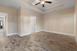 123 Bellwood Circle, Sunset Beach, NC 28468 – photo 18: Primary bedroom