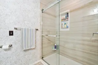 2947 Bay Village Street, Shallotte, NC 28470 — 3-bedroom home in Green Bay Village, Shallotte, NC, photo 21 of 33: Newer walk-in shower w/niche