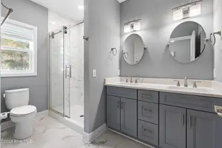 135 NW 7th Street, Oak Island, NC 28465 – photo 15: Owners Bathroom
