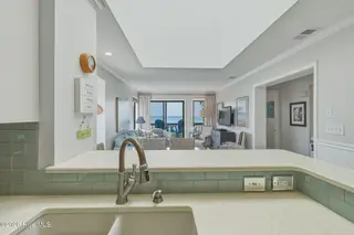 2111 W Fort Macon Road 313 Dunescape, Atlantic Beach, NC 28512 – photo 7: Kitchen with bar seating