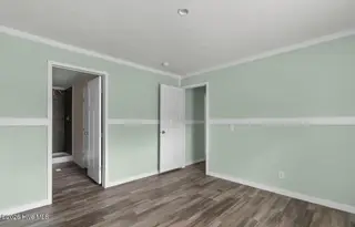 6823 Lewis Drive SE, Winnabow, NC 28479 – photo 15: Master bedroom