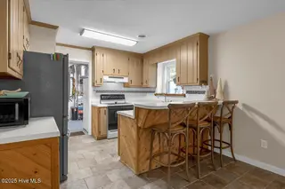 209 NE 56th Street, Oak Island, NC 28465 – photo 14: 24-Final 209 NE 56th St OKI-RJREM-9438