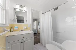 392 E First Street, Ocean Isle Beach, NC 28469 – photo 18: 1 of 2 full size bathrooms