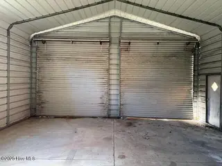 20 Chattawka Drive, Havelock, NC 28532 — 3-bedroom home in Greenfield Heights, Havelock, NC, photo 16 of 20: Detached Garage Interior View 1