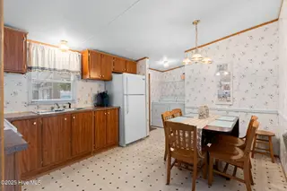 7203 Banner Street SW, Ocean Isle Beach, NC 28469 — 3-bedroom manufactured home in Seaside Heights, Ocean Isle Beach, NC, photo 11 of 38: Kitchen