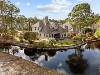 3816 Ridge Crest Drive, Southport, NC 28461 – photo 2: 65-web-or-mls-DJI_20241105144423_0161_D