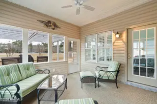 9 Golf Crest Court, Carolina Shores, NC 28467 — 3-bedroom home in Carolina Shores, Carolina Shores, NC, photo 11 of 46: Screened Porch