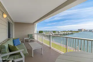 212 Old Causeway Road 107 & B13 Slip, Beaufort, NC 28516 — 3-bedroom condo in Morgan Creek Landing, Beaufort, NC, photo 7 of 49: Covered balcony