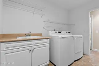 76 Calabash Drive, Calabash, NC 28467 – photo 24: Laundry Room with wash sink