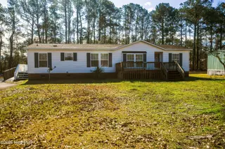 118 Woodland Drive, Swansboro, NC 28584 — 3-bedroom manufactured home in Hadnot Creek, Swansboro, NC, photo 1 of 16: 118 Woodland Dr