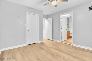 127 NW 19th Street, Oak Island, NC 28465 – photo 15: Primary Bedroom with ensuite