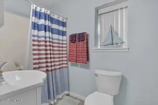 209 NE 56th Street, Oak Island, NC 28465 – photo 22: 30-Final 209 NE 56th St OKI-RJREM-9459
