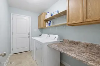 404 Hidden Oaks Drive, Jacksonville, NC 28546 – photo 14: Neat and organized laundry room