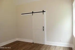 318 Bobbys Drive, Newport, NC 28570 – photo 14: Master Bedroom Barn Door June 26