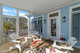 3604 W Pelican Drive, Oak Island, NC 28465 – photo 18: Screened Porch Off Living Room