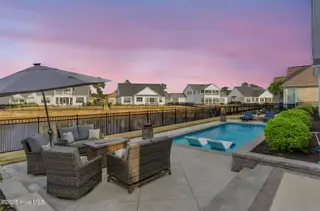 4342 Cobleskill Drive, Leland, NC 28451 – photo 2: backyard twilight