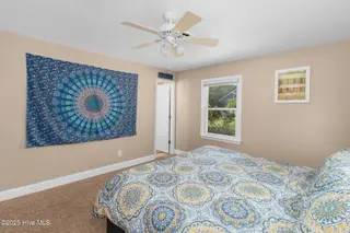 133 Doe Drive, Emerald Isle, NC 28594 – photo 18: Primary suite overlooking backyard