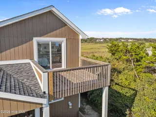 312 E Dolphin Drive, Oak Island, NC 28465 – photo 6: 6-web-or-mls-DJI_20250826170805_0119_D