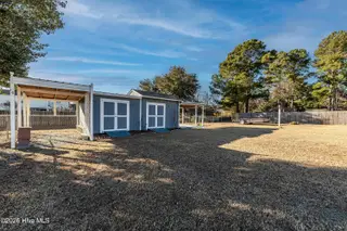 319 Riggs Road, Hubert, NC 28539 – photo 7: Back yard storage shed