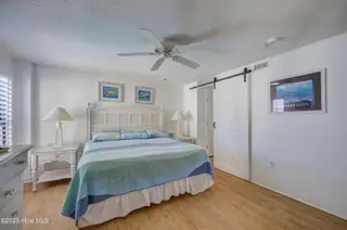 1505 Salter Path Road 435, Indian Beach, NC 28512 – photo 17: Primary BR with Barn Door